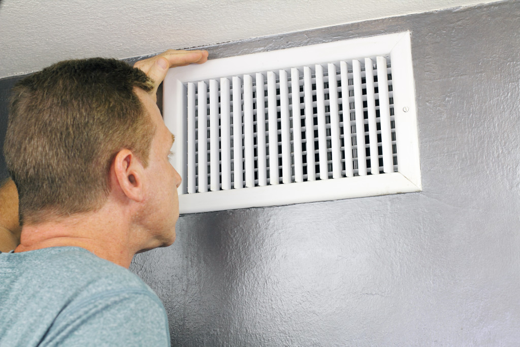 a person checking out vents