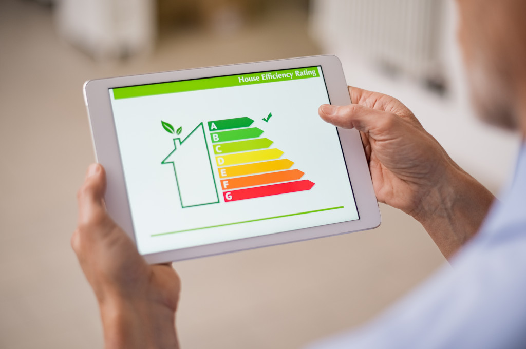 A person using a tablet to look at their home's energy efficiency