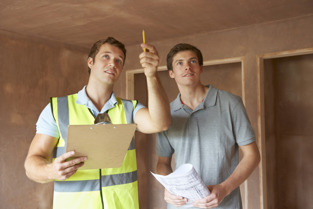 man with a home inspector in the property