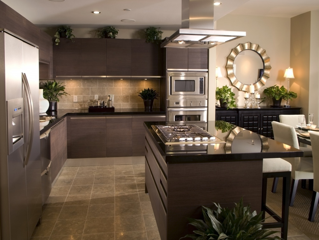 Modern kitchen design of a house with appliances tables, and chairs.