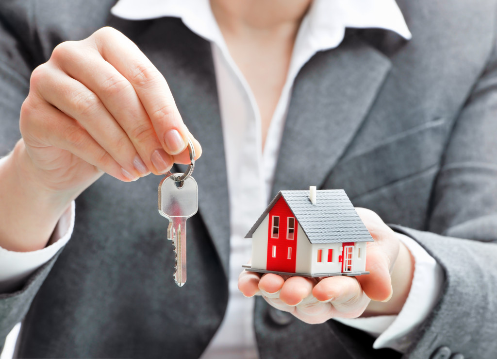 real estate agent handing over a house key