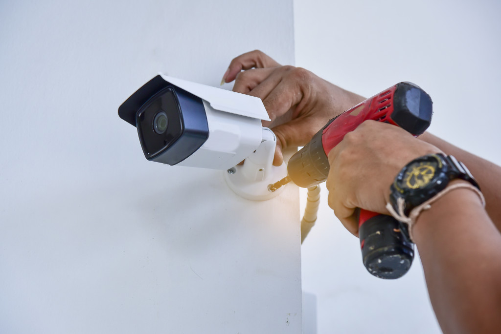 man installing a camera