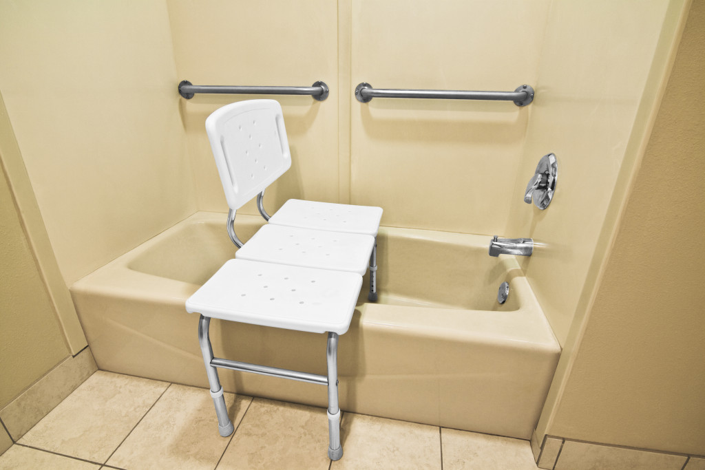 Accessible shower with a bench and grab bars