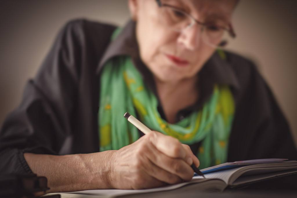 aged woman writing