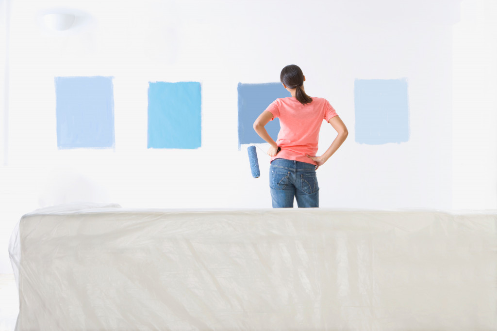 samples of blue paint on the living room wall